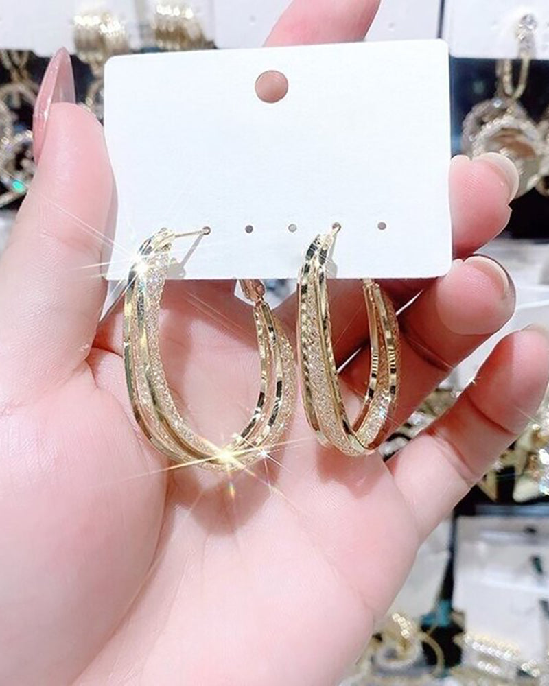 Pendientes ovalados huecos con aros en forma de U